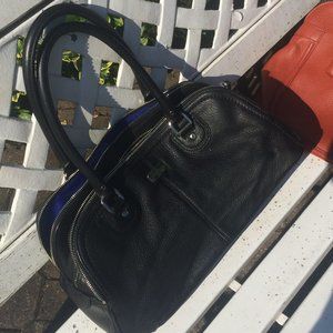 Black Cole Haan bag with blue interior